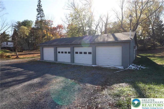 a view of a house with a yard and covered with snow
