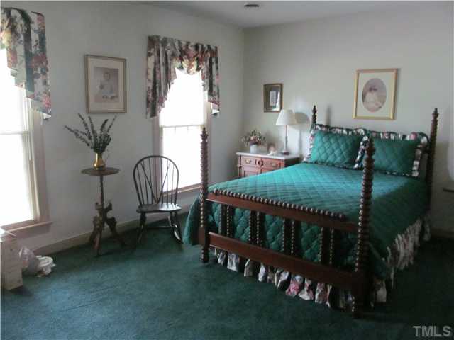 7420 Grist Mill Road Raleigh, NC 27615 - Photo 11 of 12 a bedroom with furniture and a window