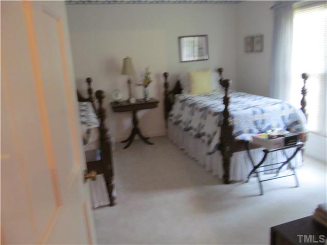 7420 Grist Mill Road Raleigh, NC 27615 - Photo 12 of 12 a bedroom with furniture and a window