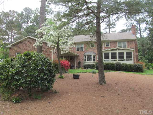 7420 Grist Mill Road Raleigh, NC 27615 - Photo 4 of 12 a view of a house with a garden