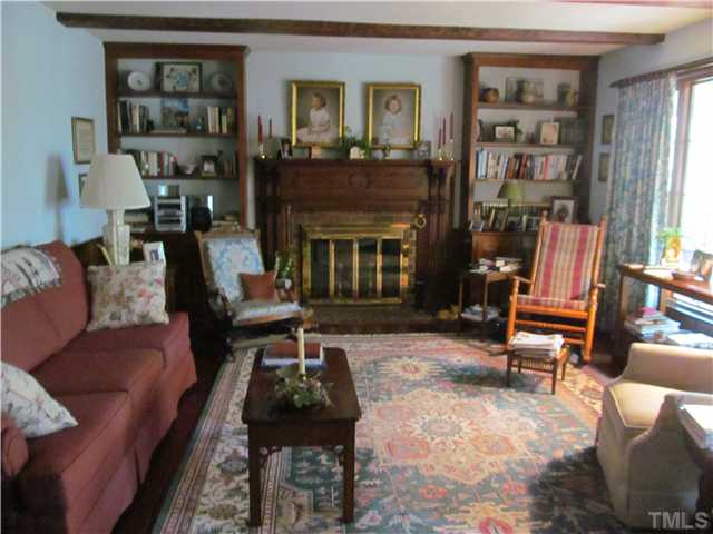 7420 Grist Mill Road Raleigh, NC 27615 - Photo 5 of 12 a living room with furniture and a fireplace