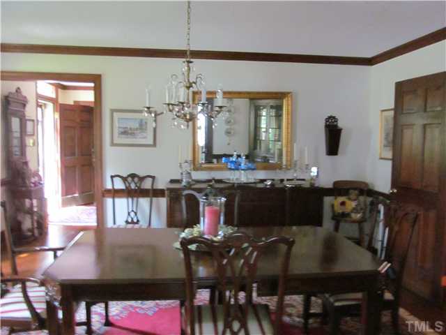 7420 Grist Mill Road Raleigh, NC 27615 - Photo 7 of 12 a view of a dining room with furniture and wooden floor