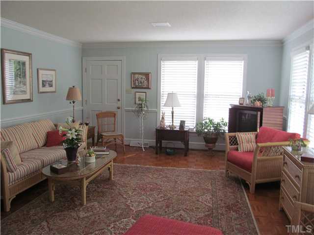 7420 Grist Mill Road Raleigh, NC 27615 - Photo 8 of 12 a living room with furniture and a large window