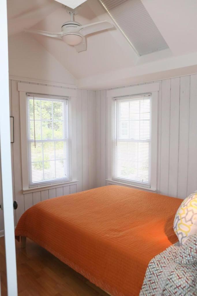 80 Bayview Road Eastham, MA 02642 - Photo 16 of 35 a bedroom with a bed and a window