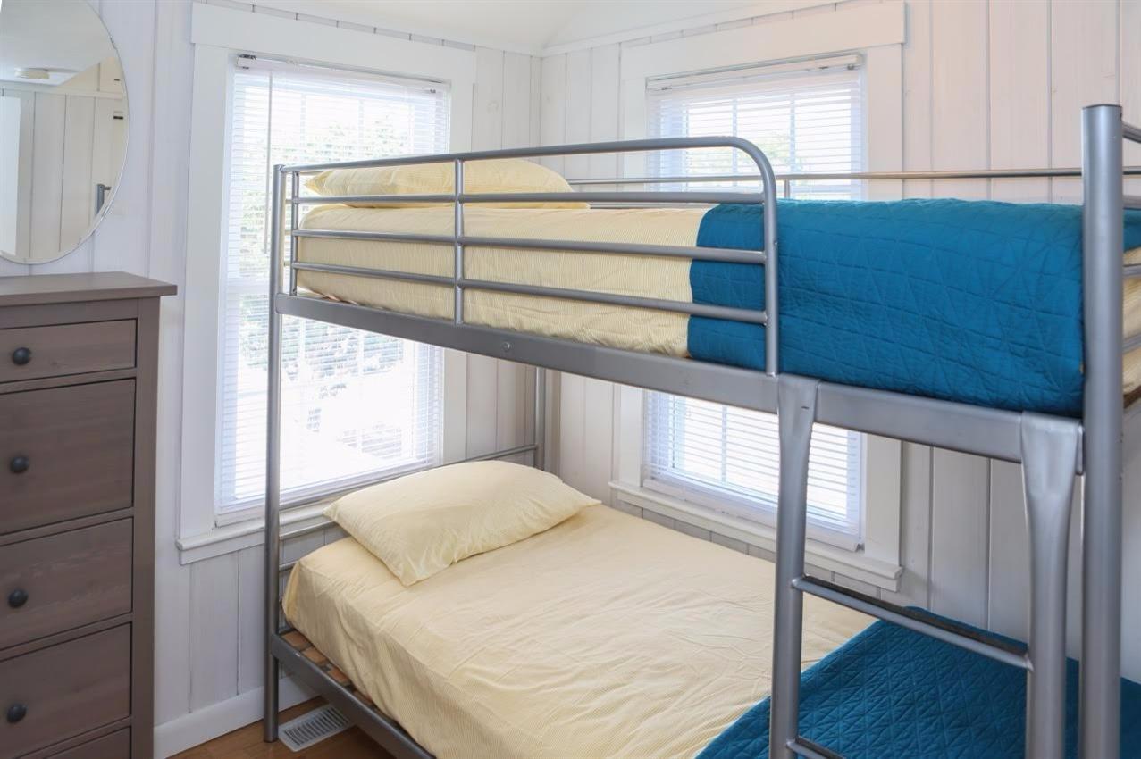 80 Bayview Road Eastham, MA 02642 - Photo 19 of 35 a bedroom with a bed and a window