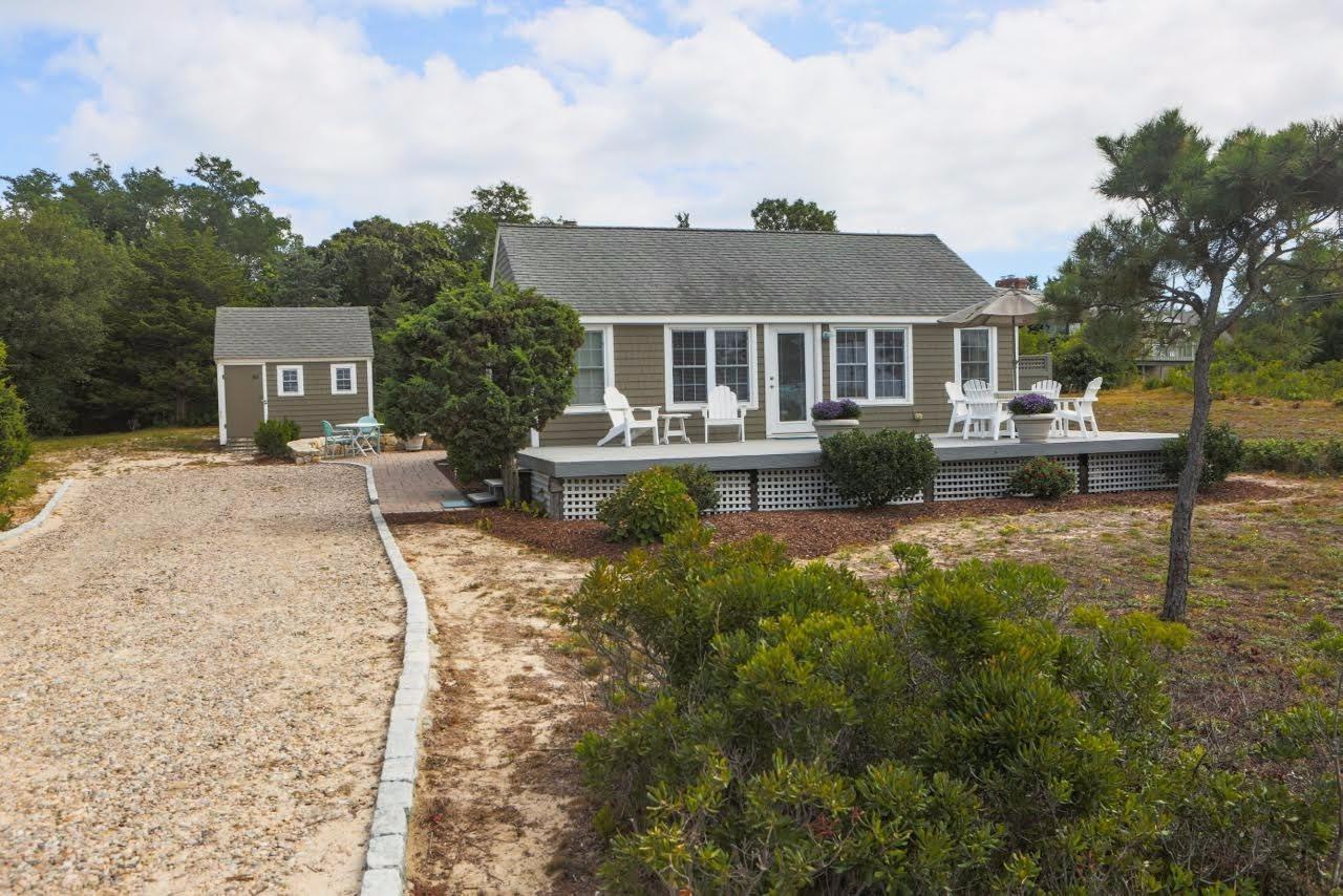 80 Bayview Road Eastham, MA 02642 - Photo 2 of 35 a front view of a house with yard and green space