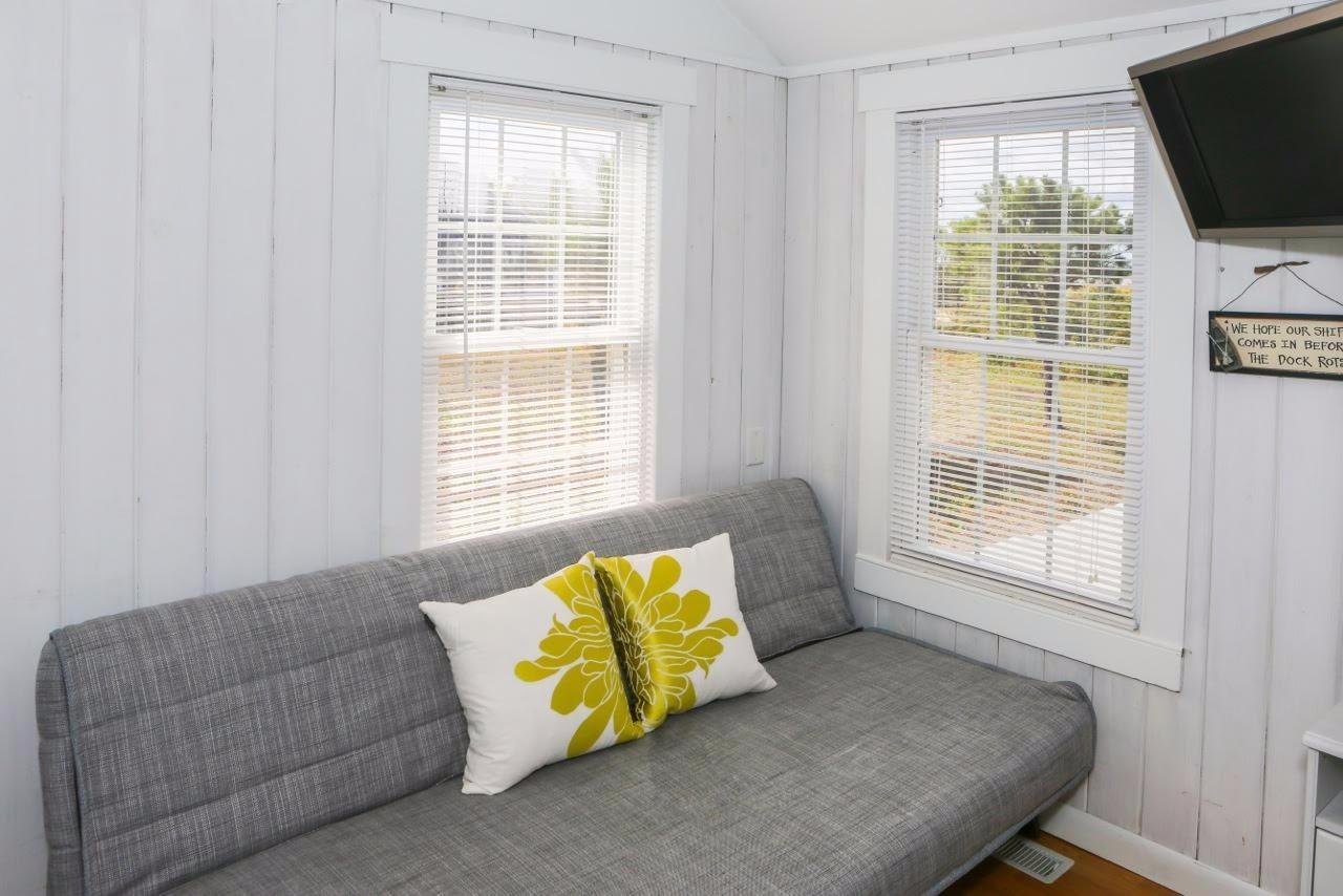 80 Bayview Road Eastham, MA 02642 - Photo 22 of 35 a living room with furniture and a flat screen tv