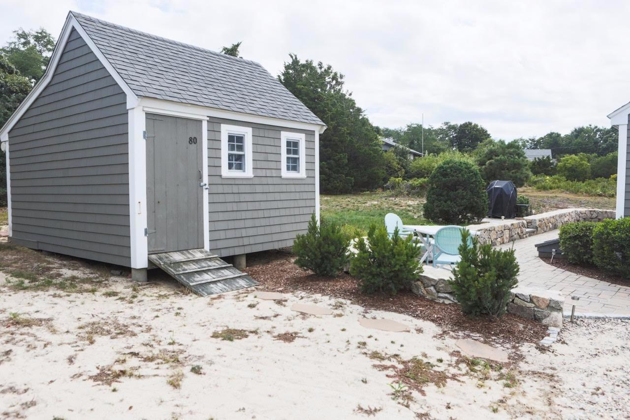 80 Bayview Road Eastham, MA 02642 - Photo 26 of 35 a view of a house with a yard