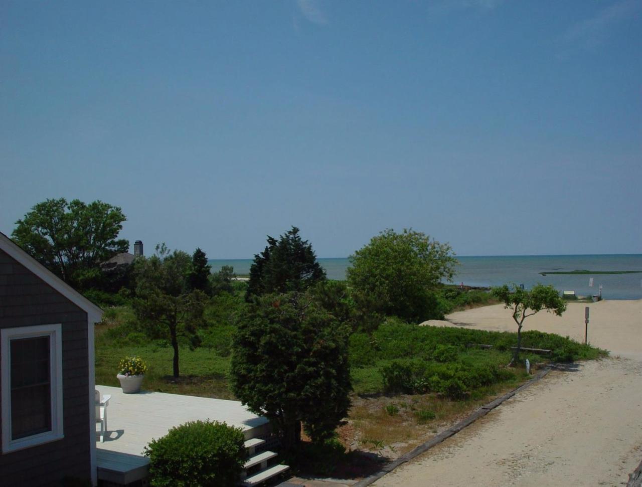 80 Bayview Road Eastham, MA 02642 - Photo 3 of 35 a view of a house with a yard and potted plants