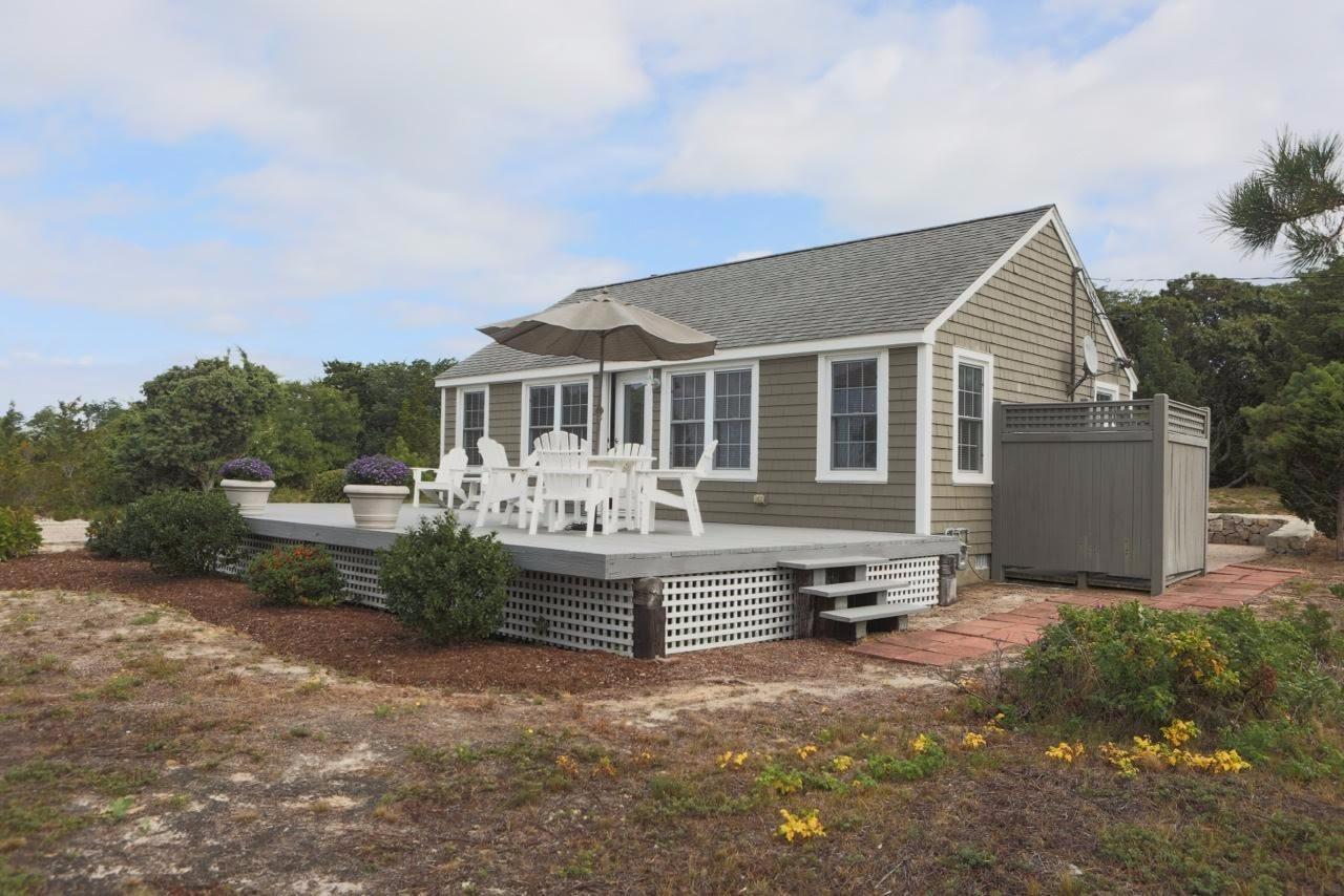 80 Bayview Road Eastham, MA 02642 - Photo 4 of 35 a front view of a house with a yard