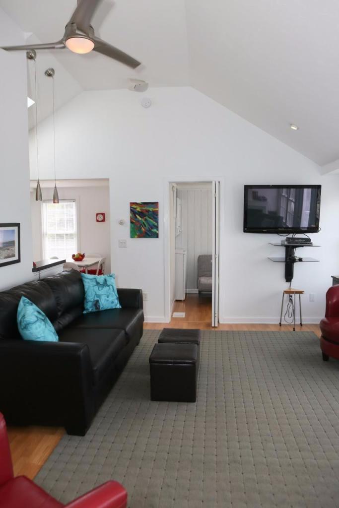 80 Bayview Road Eastham, MA 02642 - Photo 9 of 35 a living room with furniture and a flat screen tv