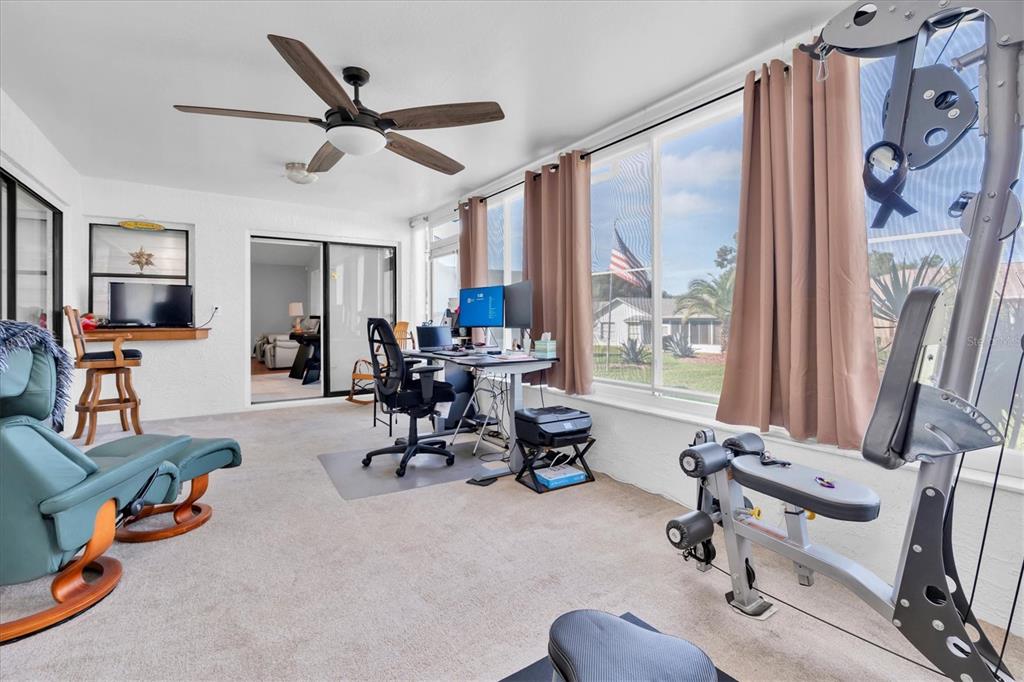 7099 Pond View Court Spring Hill, FL 34606 - Photo 31 of 64 a view of a livingroom with workspace and a window