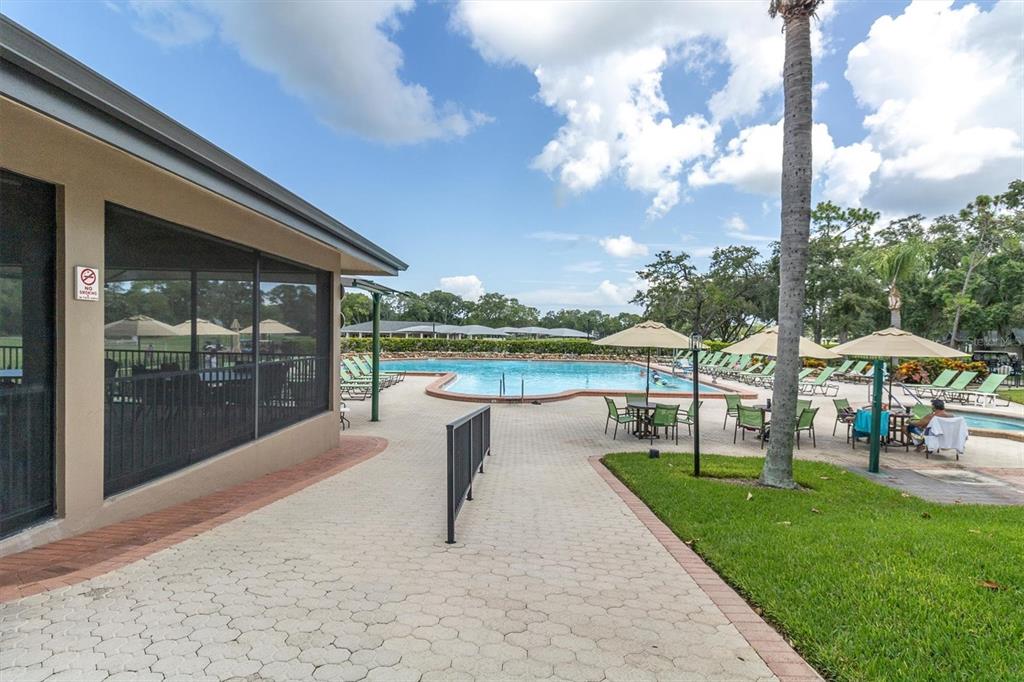 7099 Pond View Court Spring Hill, FL 34606 - Photo 47 of 64 a view of a lake with a garden and lake view