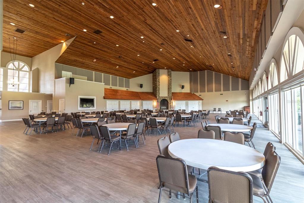 7099 Pond View Court Spring Hill, FL 34606 - Photo 57 of 64 a view of a dining room with furniture window and wooden floor