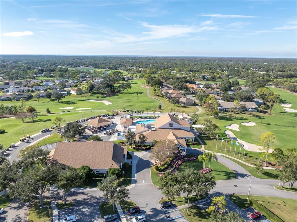7099 Pond View Court Spring Hill, FL 34606 - Photo 63 of 64 an aerial view of a city with lots of residential buildings