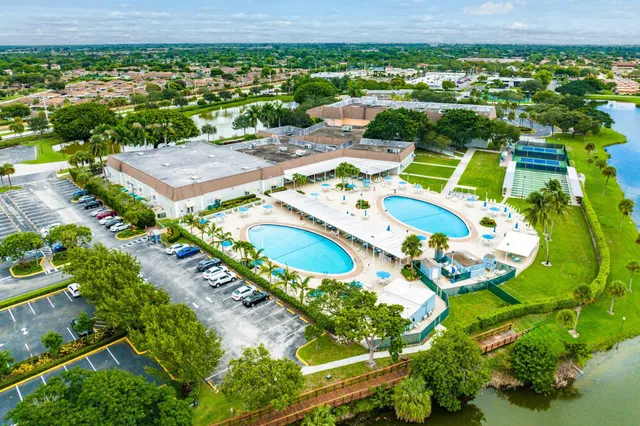an aerial view of a swimming pool patio and mountain view