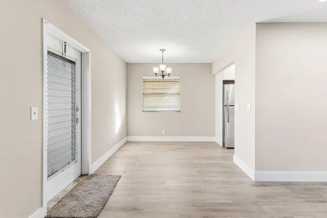 a view of an empty room and window