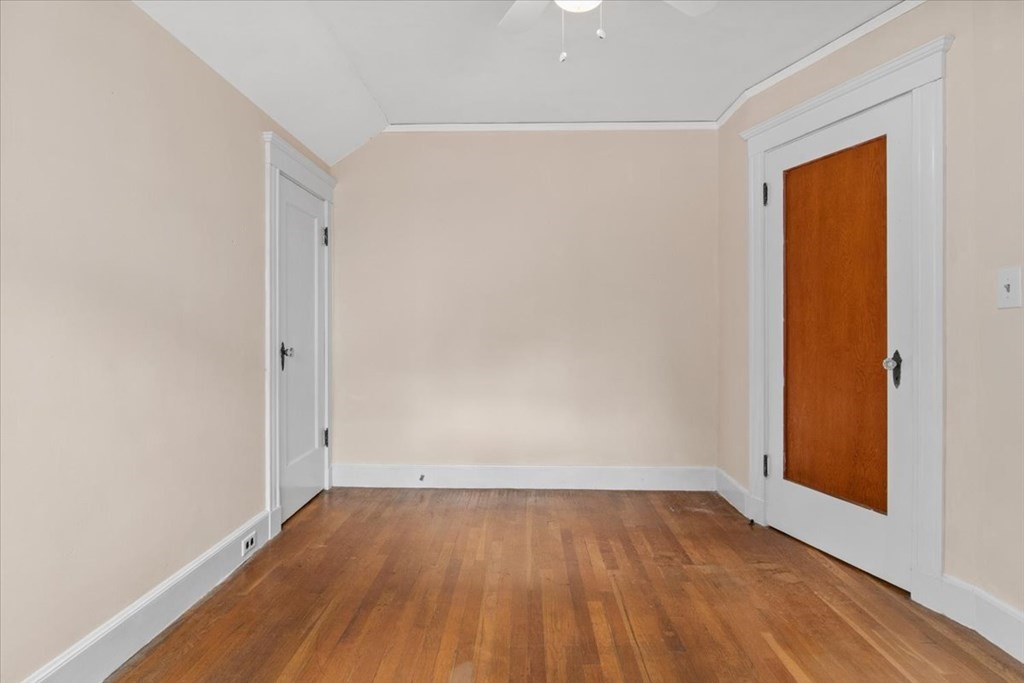 41 Bogandale Road Boston, MA 02132 - Photo 22 of 38 an empty room with wooden floor and entrance