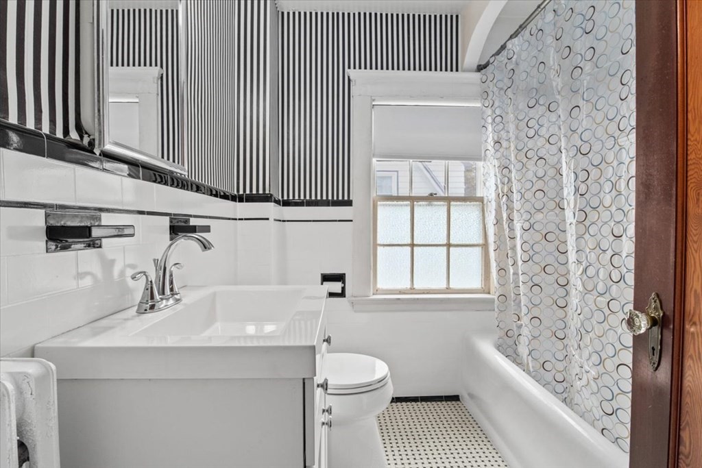 41 Bogandale Road Boston, MA 02132 - Photo 24 of 38 a bathroom with a sink a toilet and tub