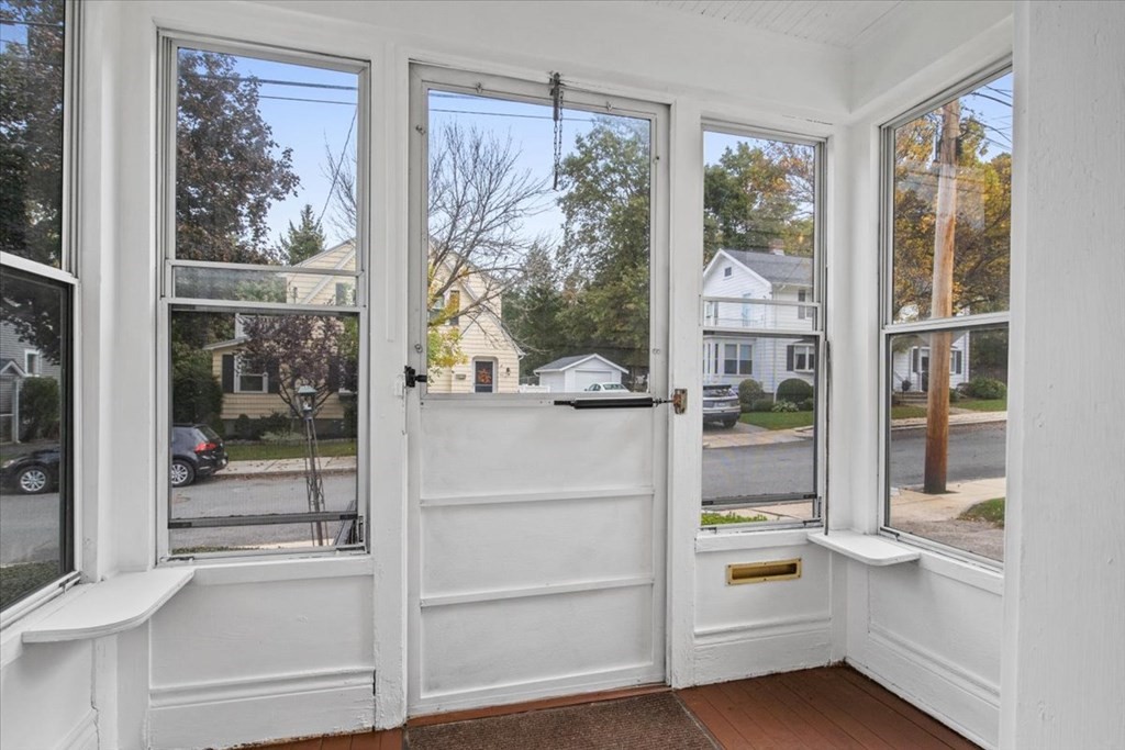 41 Bogandale Road Boston, MA 02132 - Photo 3 of 38 a kitchen with white cabinets and a wooden floor