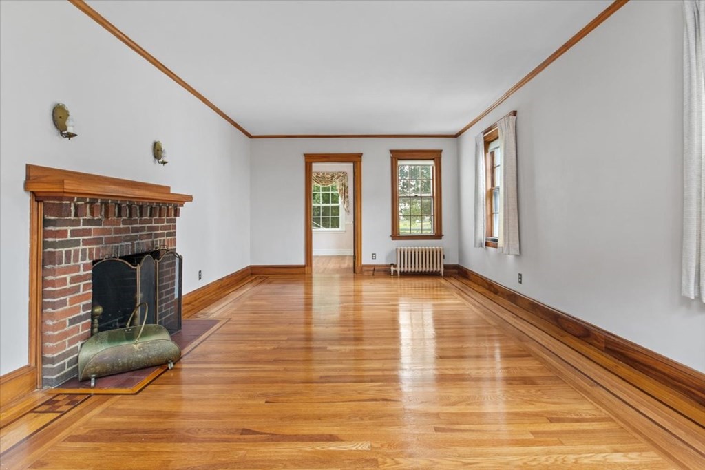 41 Bogandale Road Boston, MA 02132 - Photo 5 of 38 a view of an empty room with glass door and windows