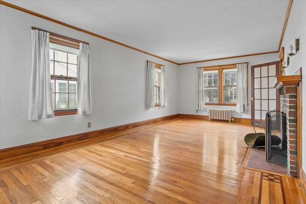 41 Bogandale Road Boston, MA 02132 - Photo 6 of 38 a view of empty room with wooden floor and fan