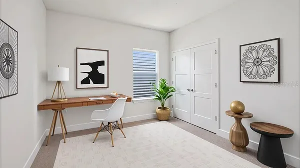 a living room with furniture and a potted plant