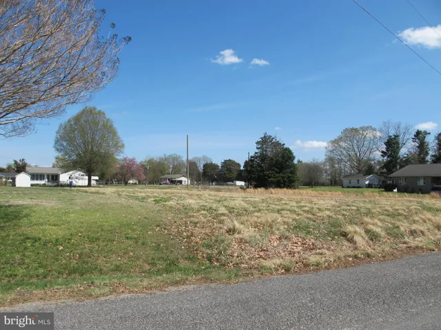 a view of a road with a building in the background