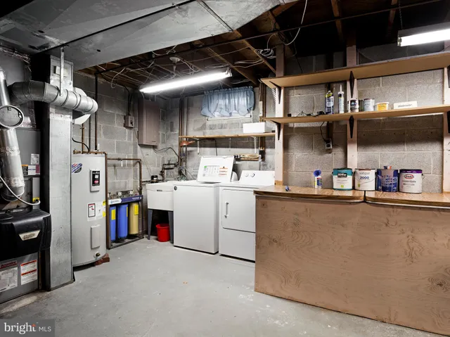 a kitchen with refrigerator and cabinets