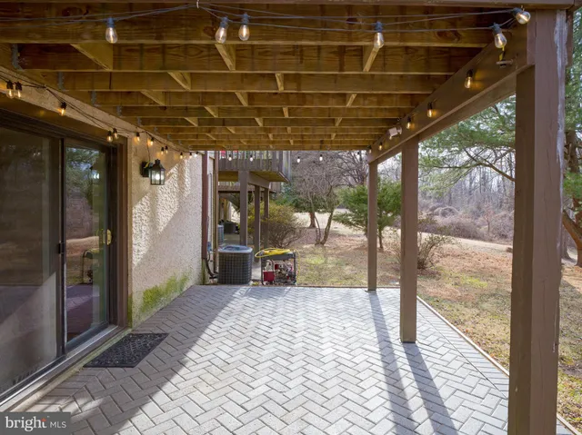 a view of a brick house with large windows