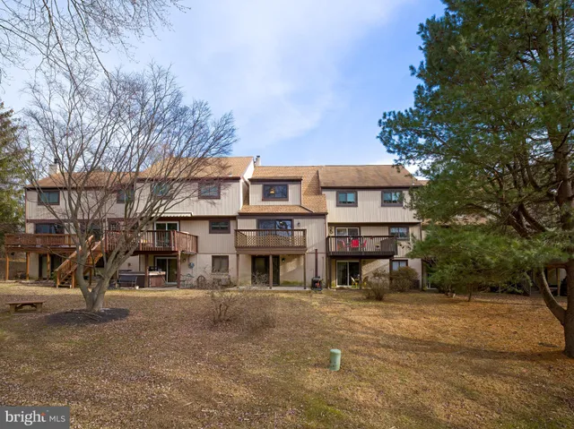 a view of a water fountain in front of a house