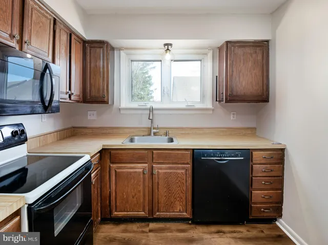 a kitchen with a sink and a stove