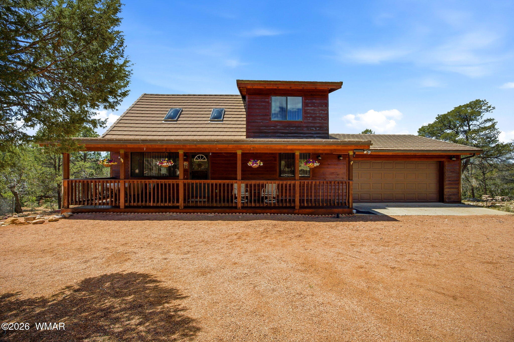2806 Sky Hawk Drive Overgaard, AZ 85933 - Photo 4 of 43 front view of a house with a yard
