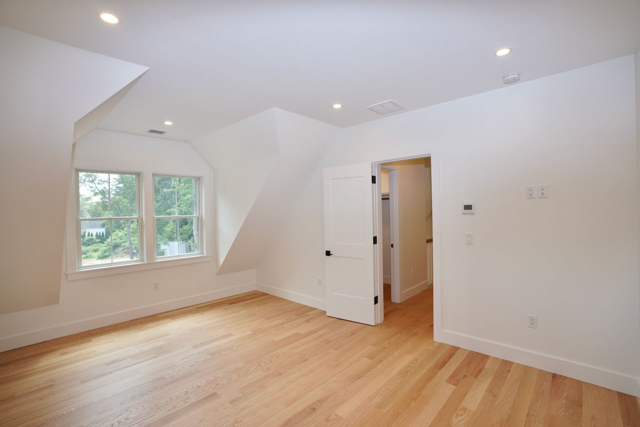 5 Ogden Lane Edgartown, MA 02539 - Photo 19 of 22 an empty room with wooden floor and windows