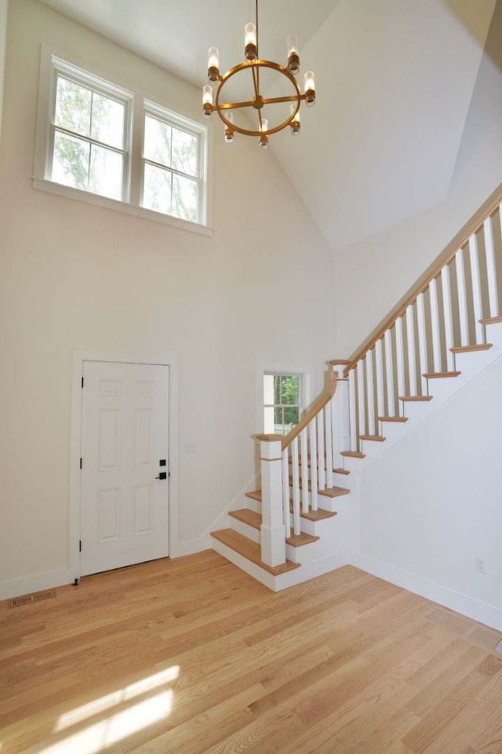 5 Ogden Lane Edgartown, MA 02539 - Photo 4 of 22 a view of an empty room with stairs and a window