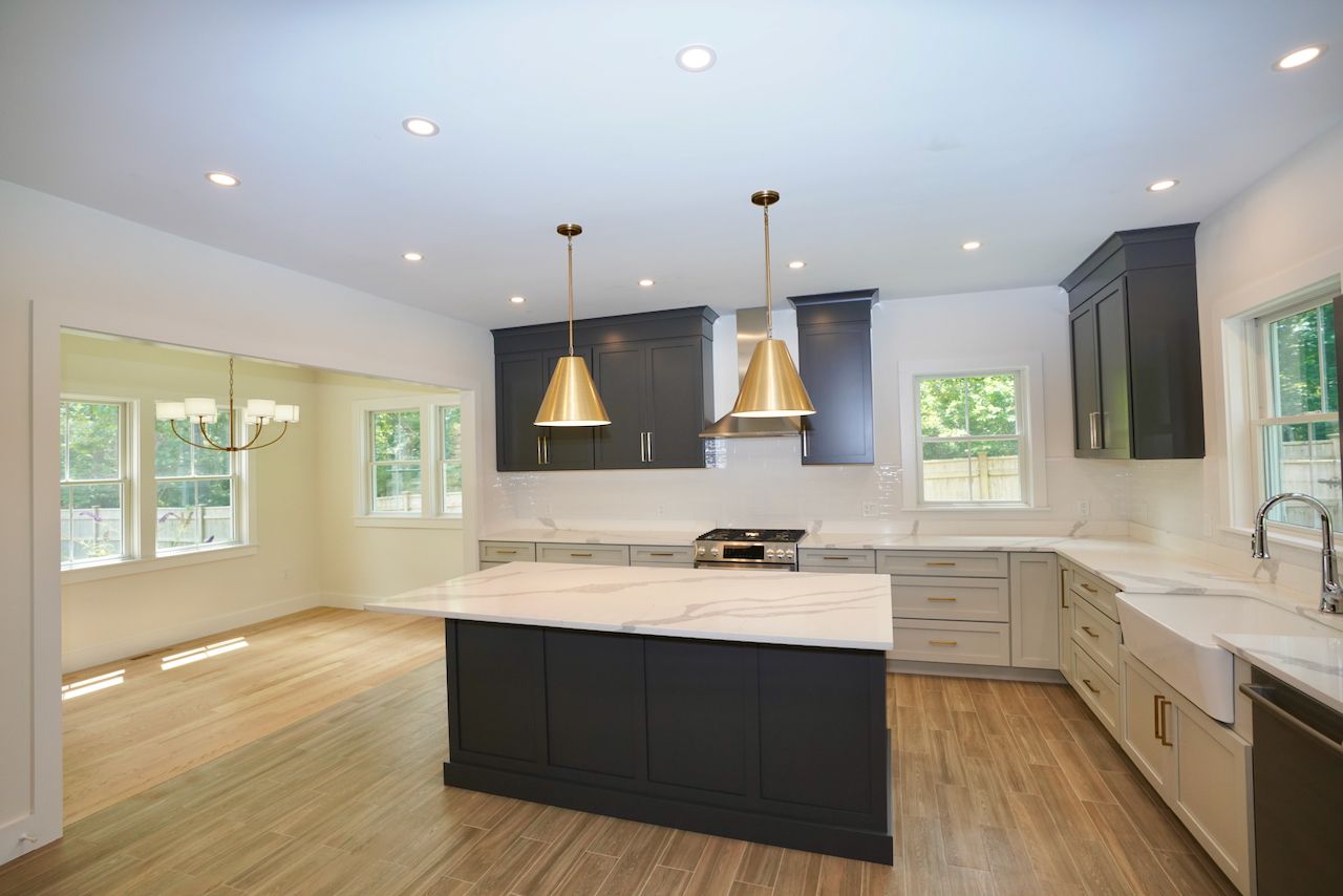 5 Ogden Lane Edgartown, MA 02539 - Photo 6 of 22 a kitchen with a sink cabinets and wooden floor