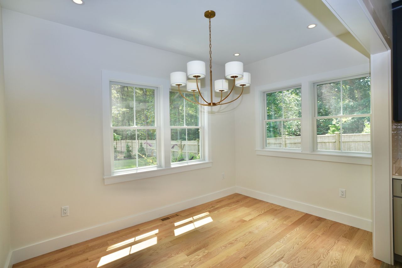 5 Ogden Lane Edgartown, MA 02539 - Photo 7 of 22 a view of a room with wooden floor and chandelier