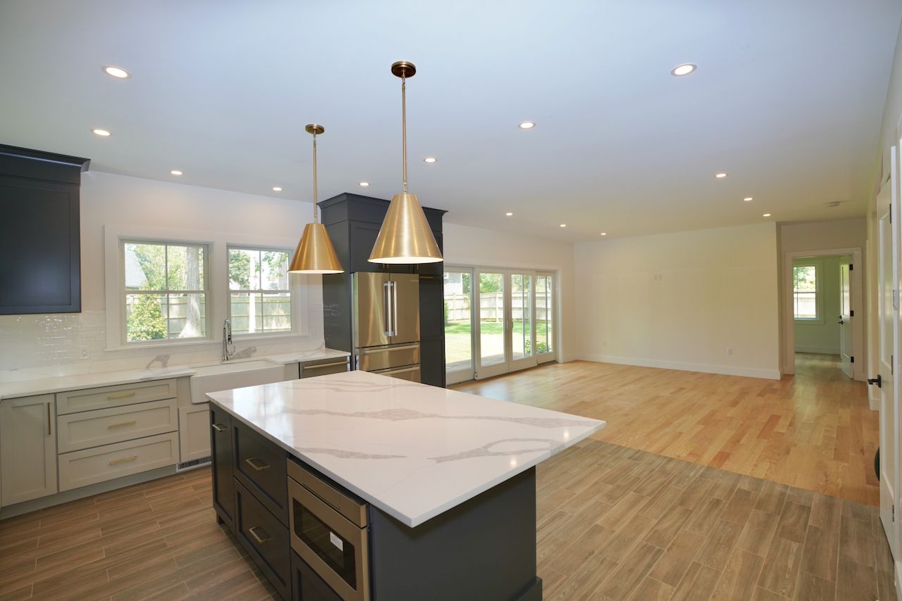 5 Ogden Lane Edgartown, MA 02539 - Photo 8 of 22 a kitchen with kitchen island a sink dishwasher a stove and a wooden floors