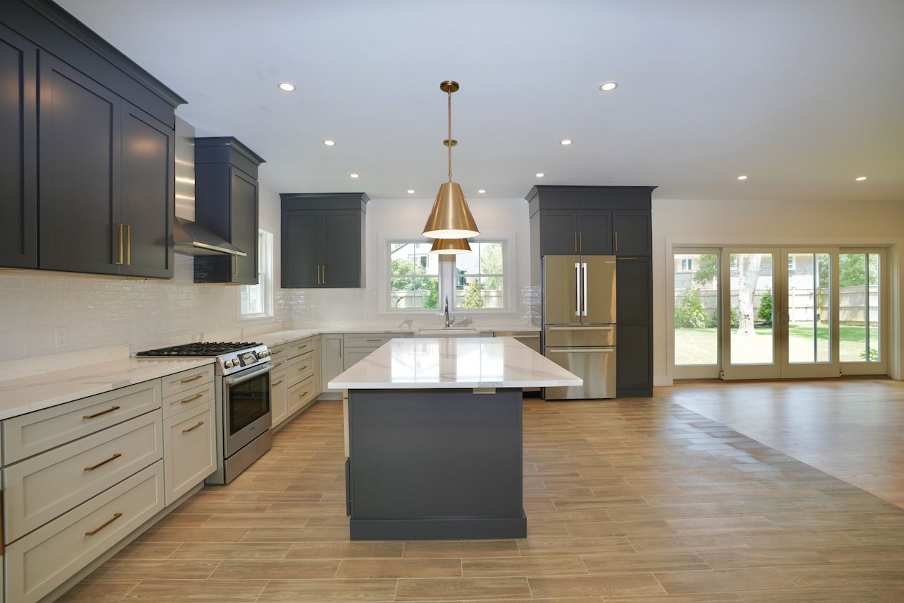 5 Ogden Lane Edgartown, MA 02539 - Photo 9 of 22 a kitchen with kitchen island granite countertop wooden floor stainless steel appliances and a center island