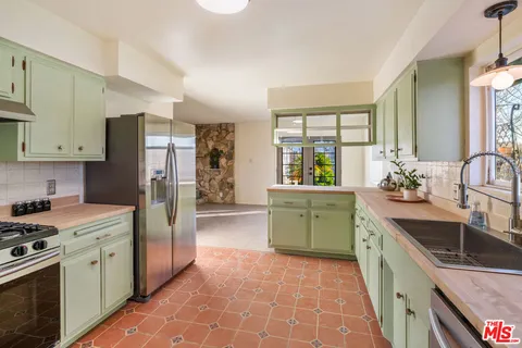 a view of a kitchen with a kitchen and a sink