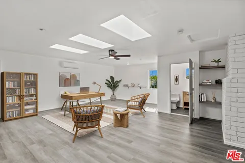 a view of a garden with a building in the background