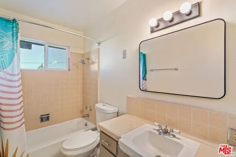a kitchen with granite countertop appliances and cabinets