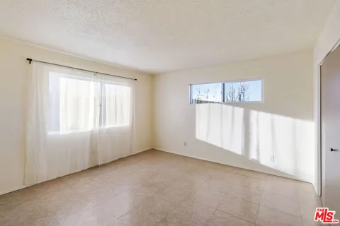 a kitchen with stainless steel appliances granite countertop a stove and a refrigerator