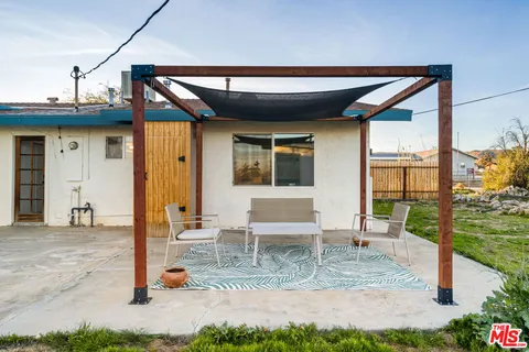 a view of a house with snow on the road