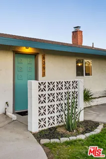 a kitchen with a table and chairs in it