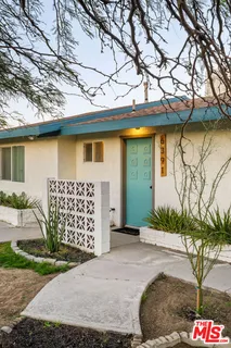 a view of a kitchen center island cabinets and wooden floor