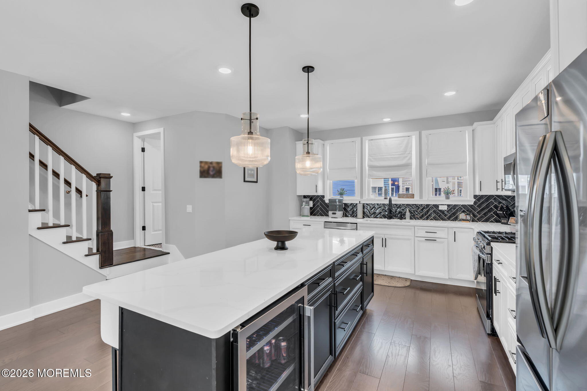 12 Raritan Boulevard Keyport, NJ 07735 - Photo 12 of 41 a kitchen with stainless steel appliances a stove a sink a refrigerator and white cabinets