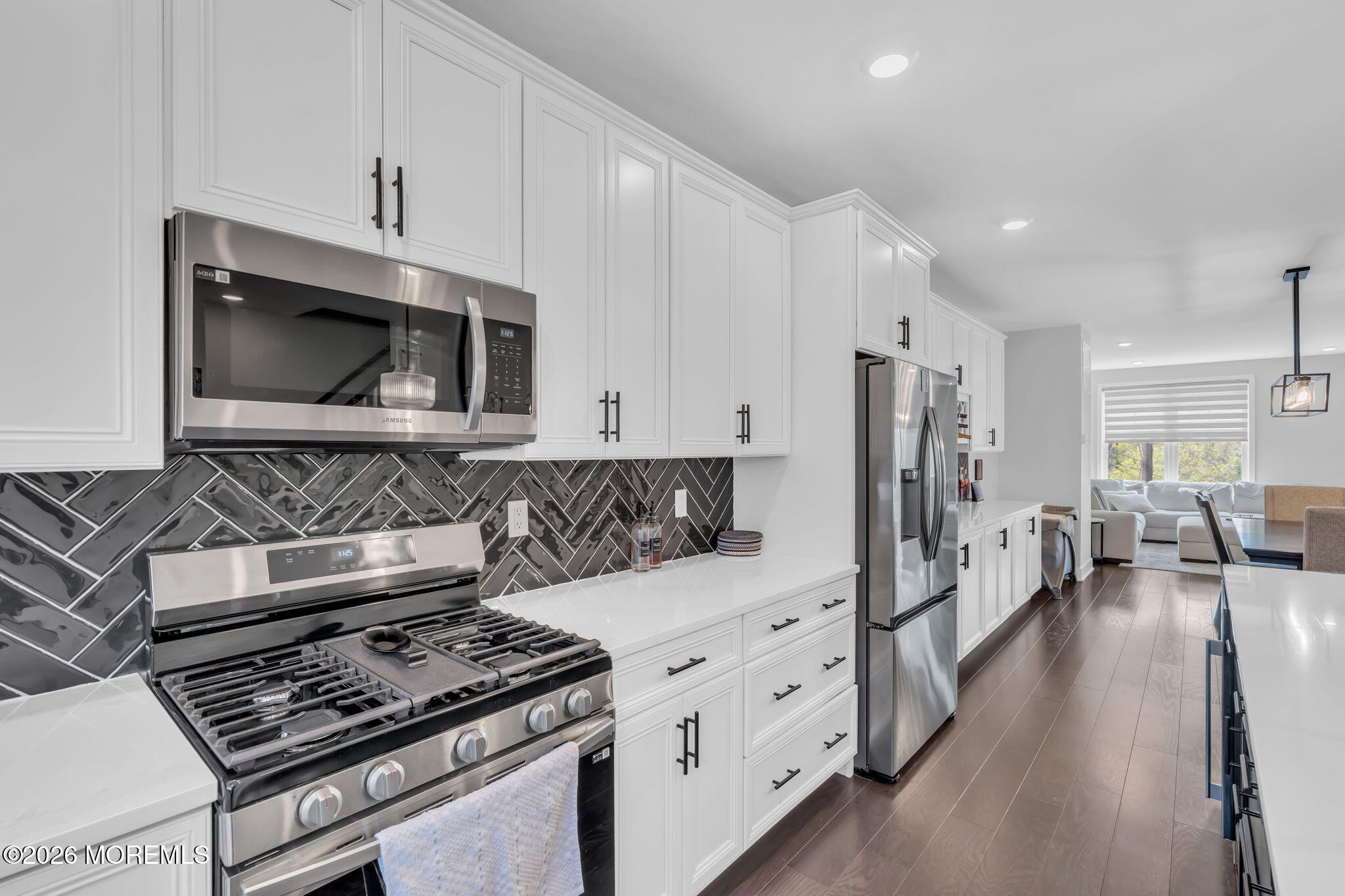 12 Raritan Boulevard Keyport, NJ 07735 - Photo 14 of 41 a kitchen with stainless steel appliances a stove a microwave and cabinets