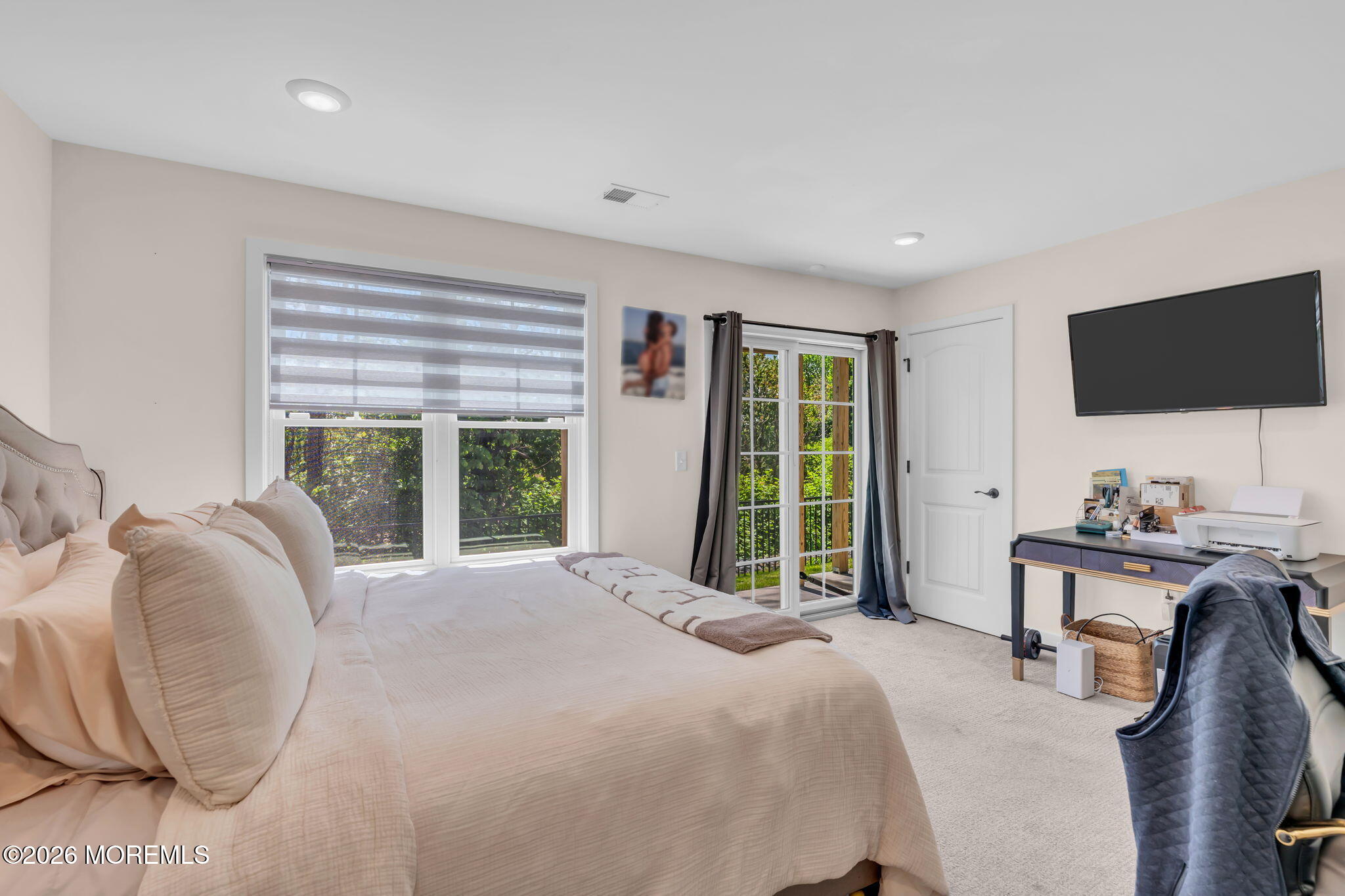 12 Raritan Boulevard Keyport, NJ 07735 - Photo 19 of 41 a bedroom with a bed and a flat screen tv