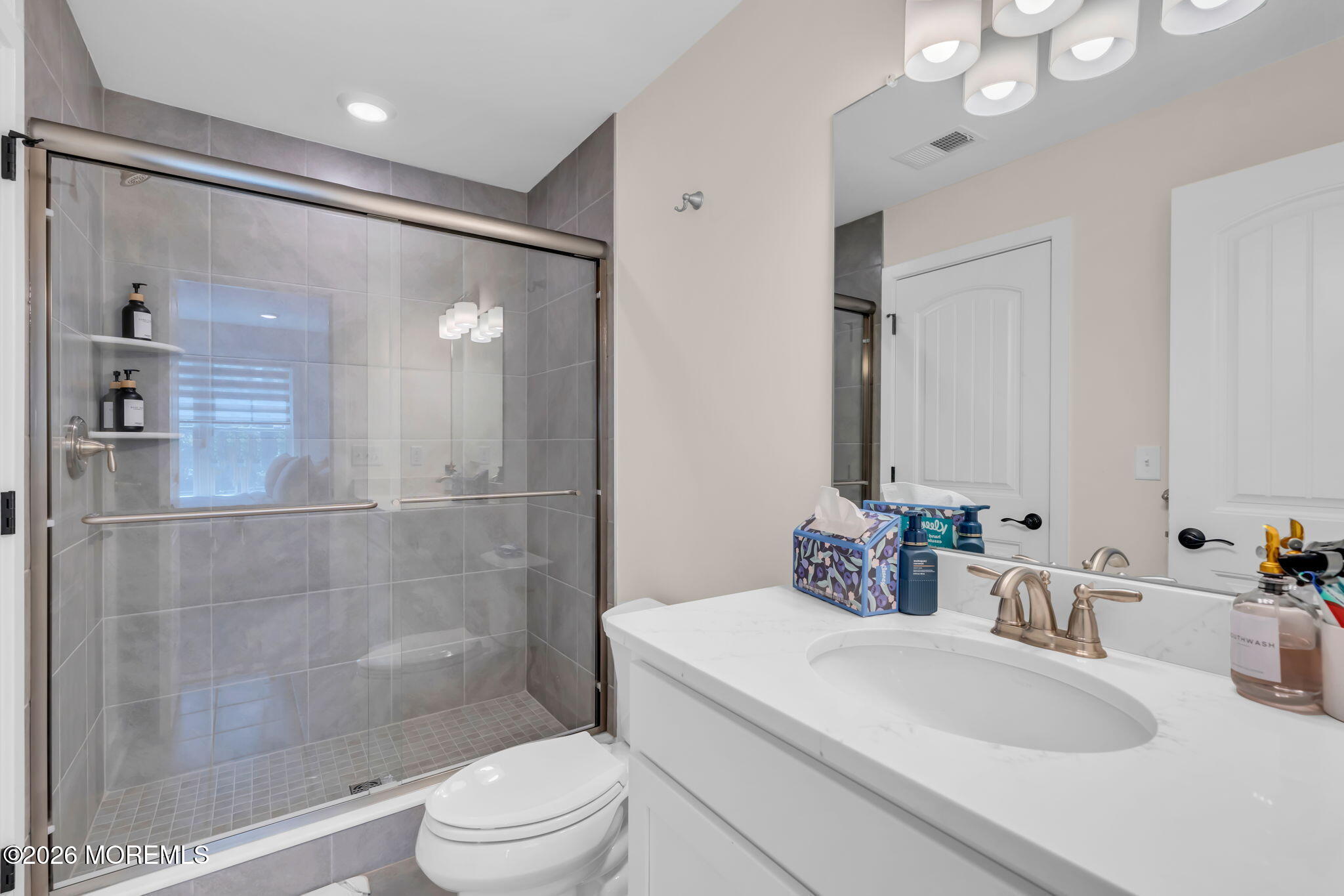 12 Raritan Boulevard Keyport, NJ 07735 - Photo 21 of 41 a bathroom with a sink a toilet and shower